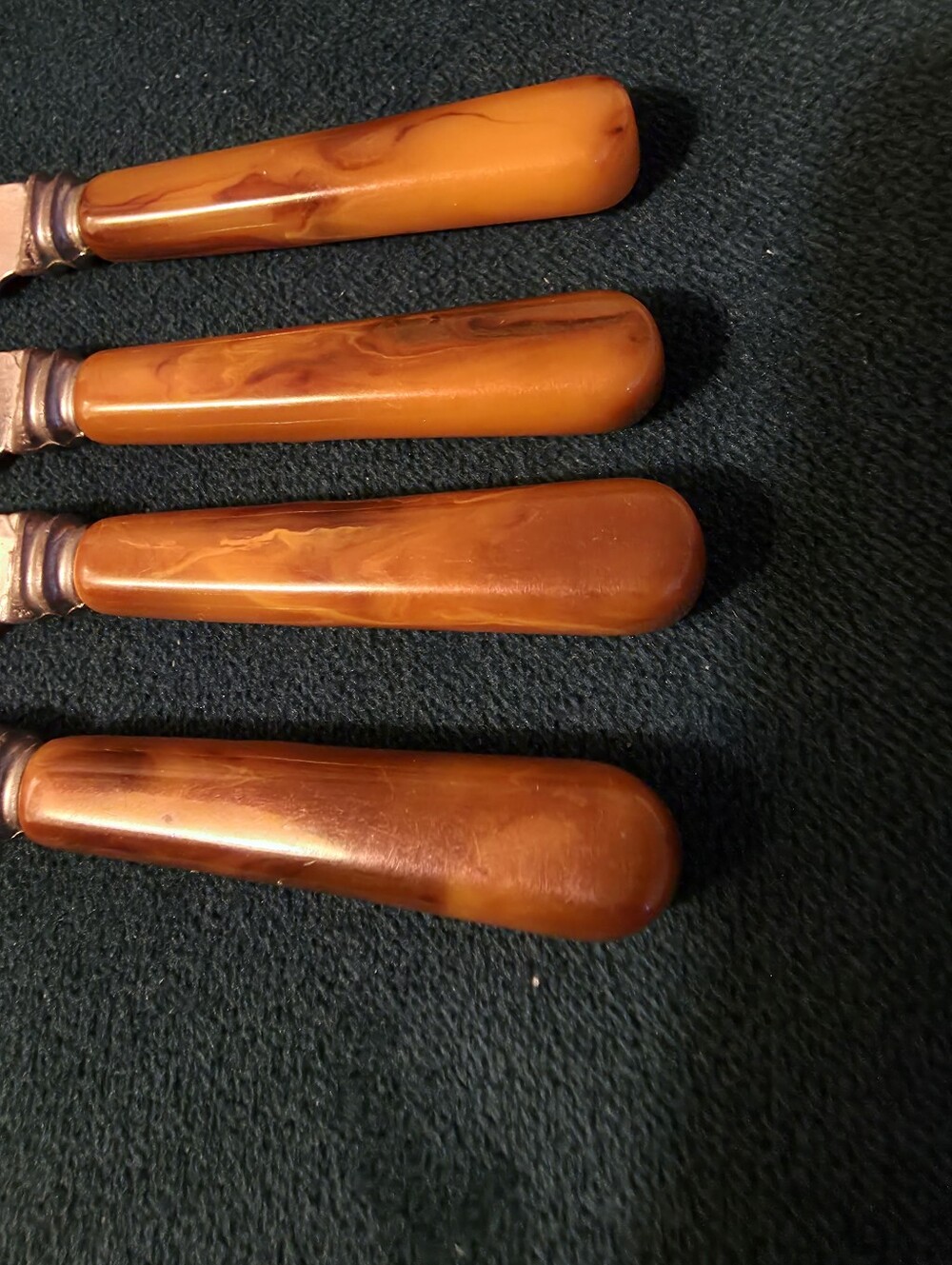 set of four vintage "Dinkee" brand butter, cheese, or food spreader knives